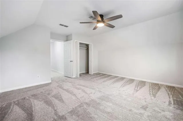 a view of a backyard with chair and table