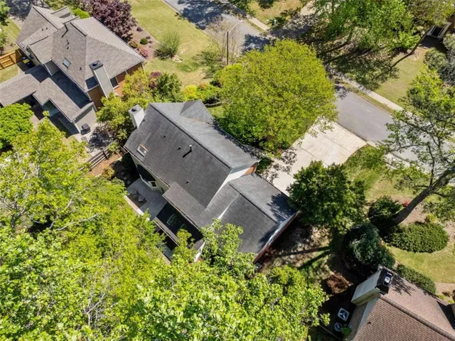 an aerial view of a house with a garden