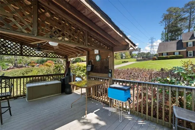 a view of a house with backyard porch and sitting area