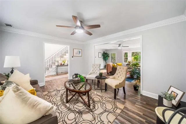 a living room with furniture and a fireplace