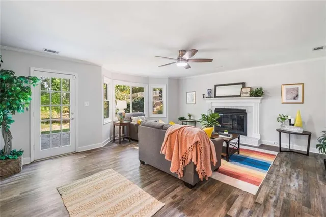 a living room with furniture fireplace and window