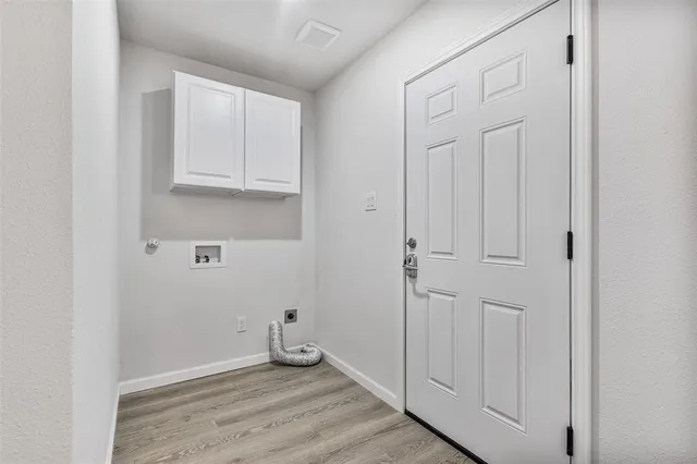 an empty room with wooden floor