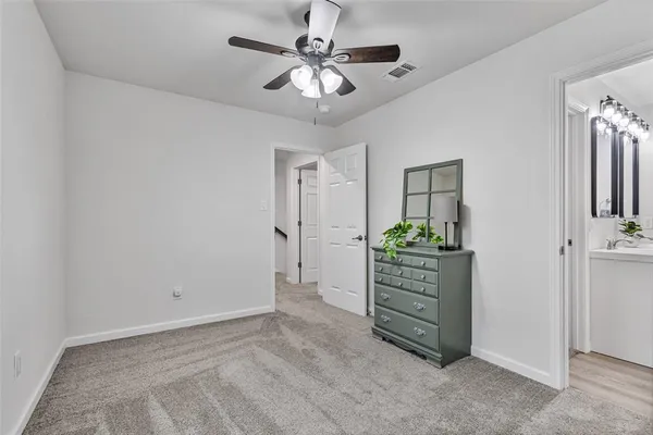 a view of a hallway with closet and cabinet