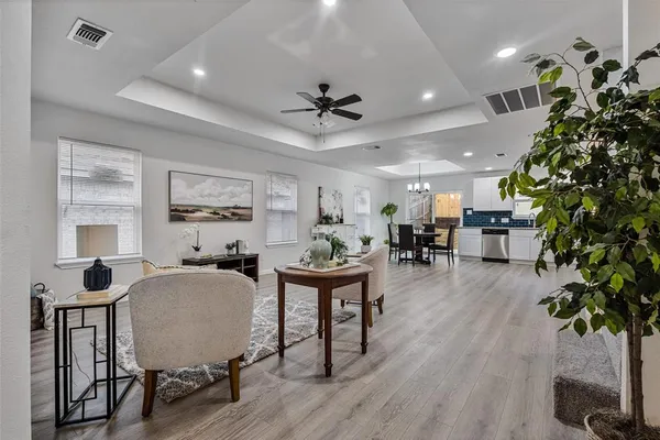 a living room with furniture potted plant and a window