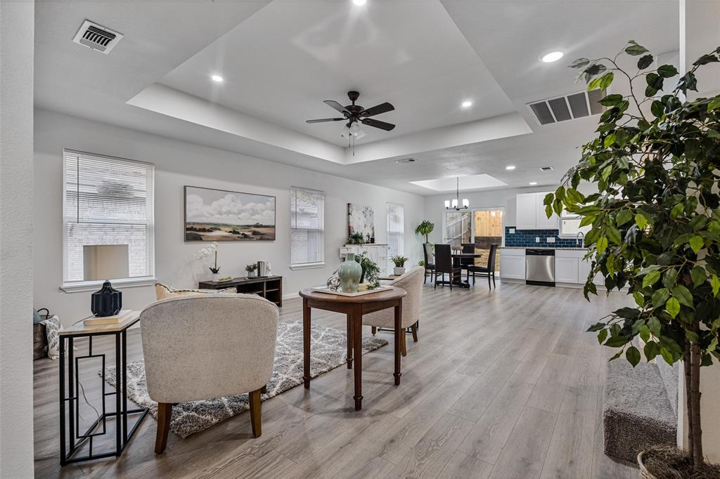 1009 North Barrett Avenue Denison, TX 75020 - Photo 6 of 38 a living room with furniture potted plant and a window