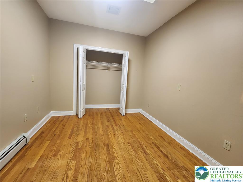 578 Daniels Road Nazareth, PA 18064 - Photo 30 of 45 Rich hardwood flooring complements the neutral walls of this versatile secondary bedroom space.