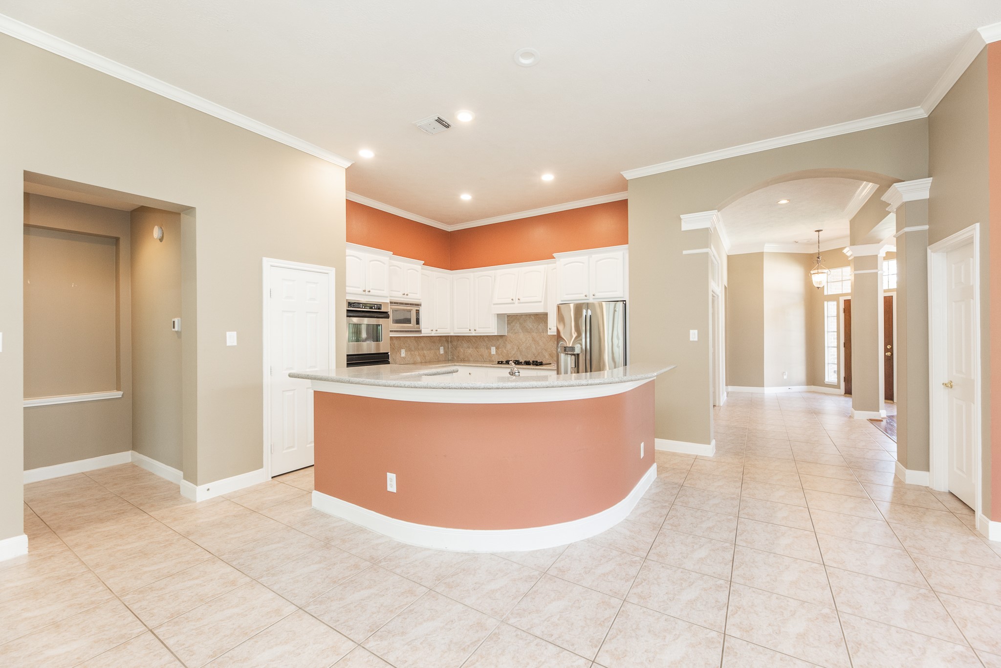 1222 Brinson Court Spring, TX 77379 - Photo 17 of 35 a view of a living room kitchen with stainless steel appliances granite countertop a couch and a view of living room