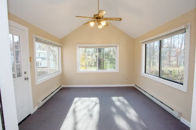 a view of an empty room with a window