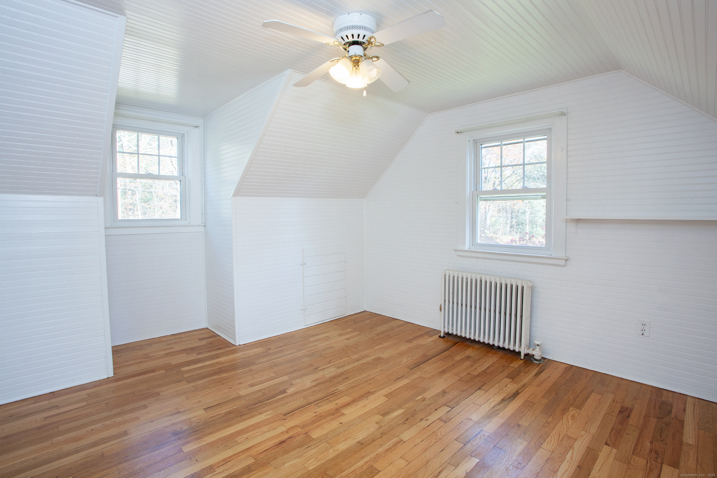 80 Walnut Hill Road East Hartland, CT 06027 - Photo 25 of 33 a view of empty room with wooden floor and fan