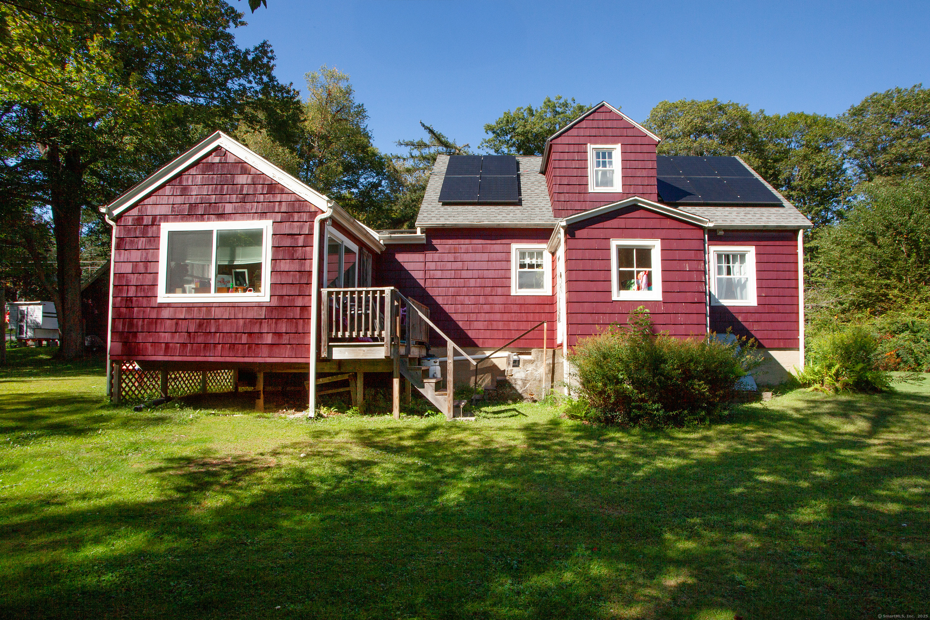 80 Walnut Hill Road East Hartland, CT 06027 - Photo 3 of 33 a front view of a house with a yard