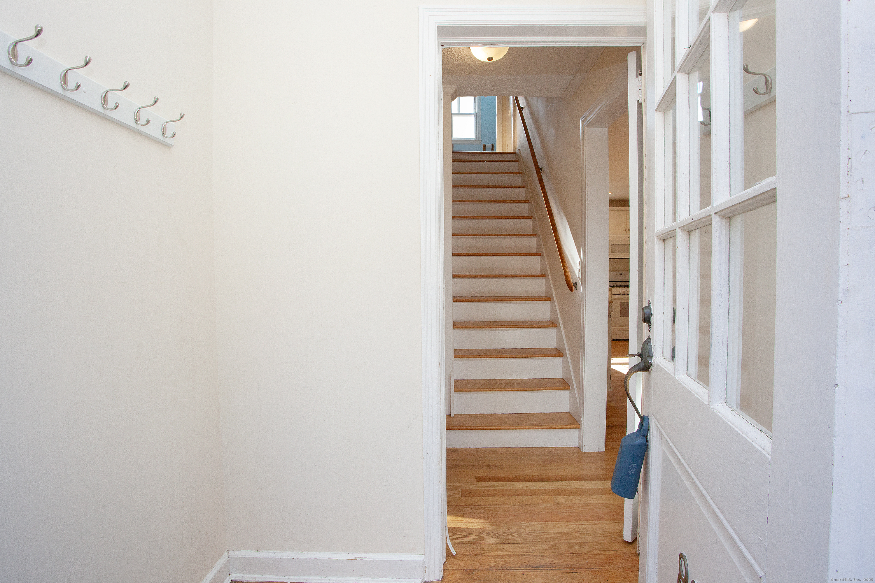 80 Walnut Hill Road East Hartland, CT 06027 - Photo 6 of 33 a view of staircase with white walls and white door