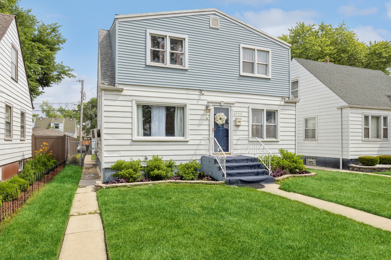 3922 West 85th Place Chicago, IL 60652 - Photo 2 of 17 a front view of a house with a garden