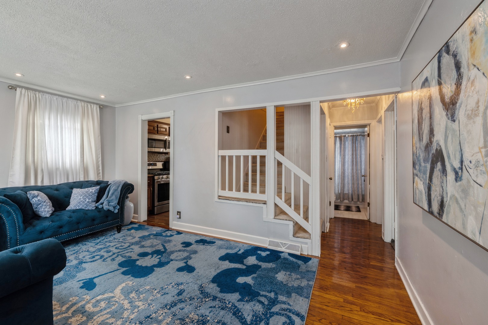 3922 West 85th Place Chicago, IL 60652 - Photo 4 of 17 a living room with furniture and a rug