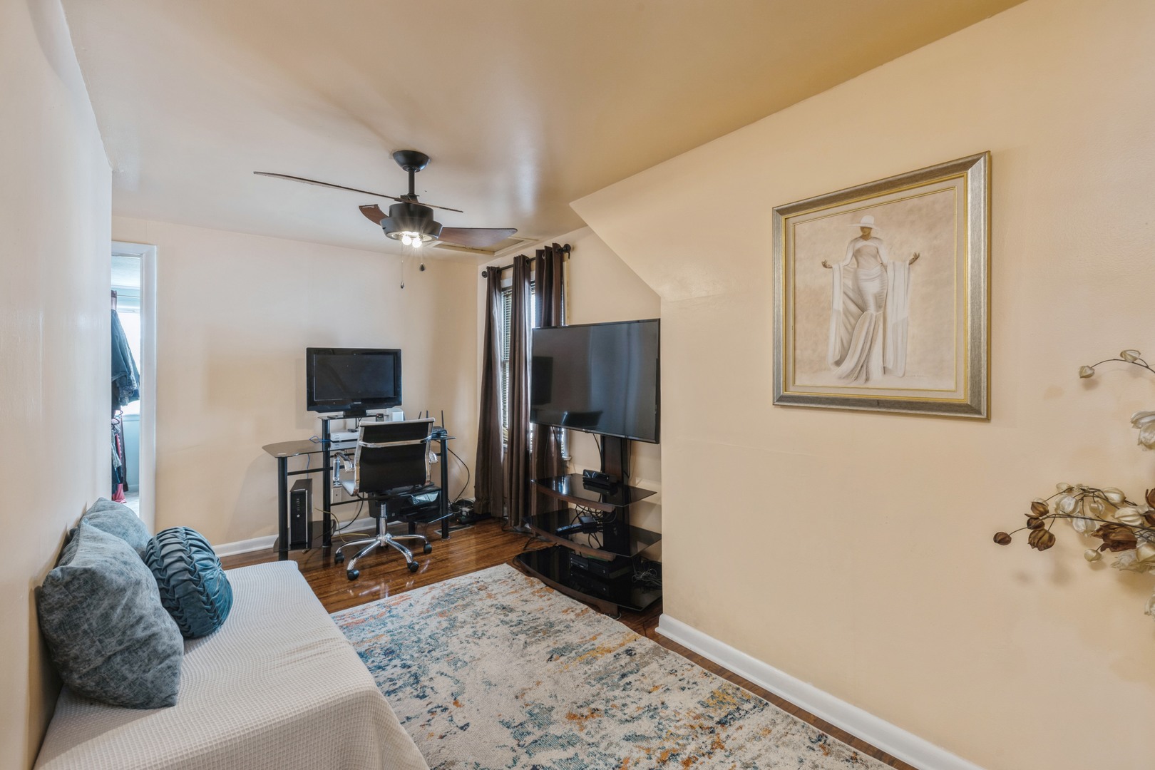 3922 West 85th Place Chicago, IL 60652 - Photo 6 of 17 a living room with furniture and a flat screen tv