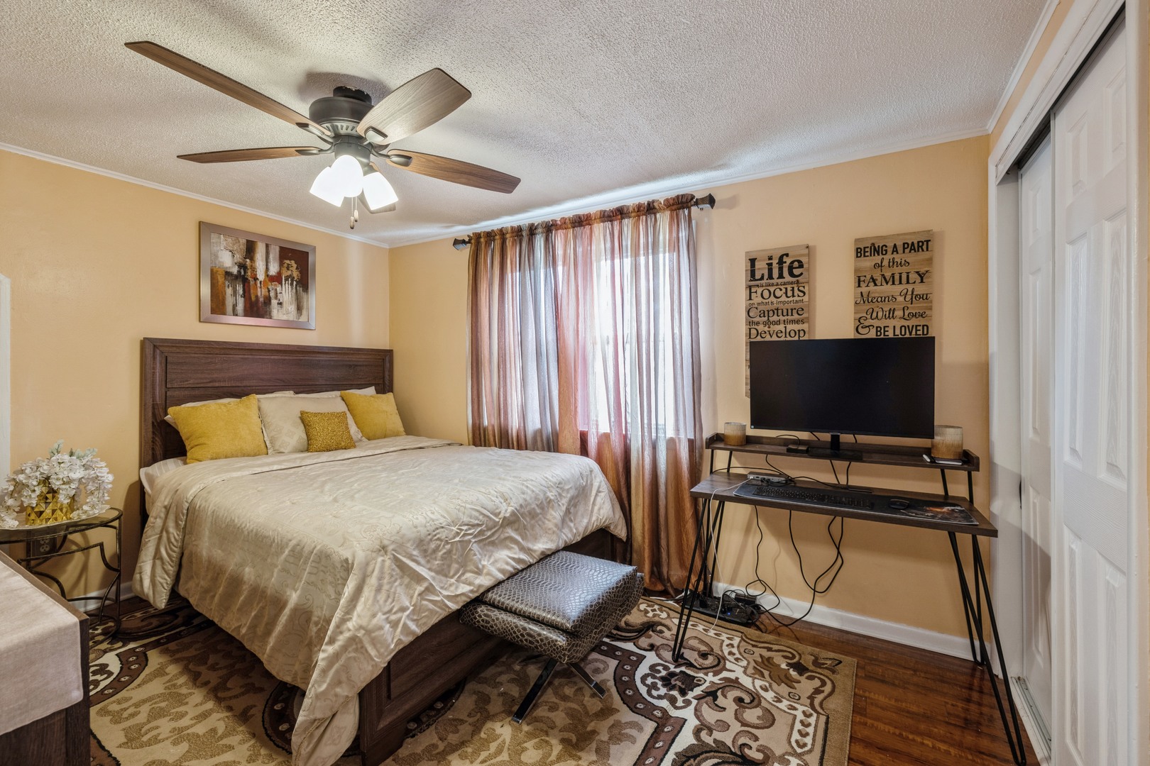 3922 West 85th Place Chicago, IL 60652 - Photo 9 of 17 a bedroom with a bed and a flat screen tv