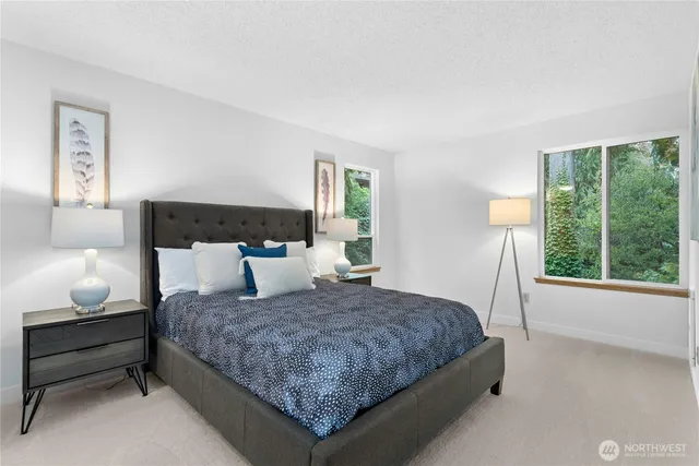 a bedroom with a bed and window