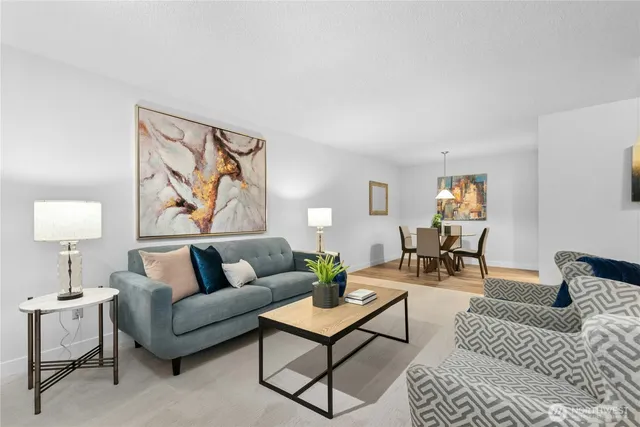 a living room with furniture and a lamp