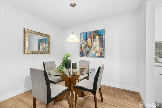 a view of a dining room with furniture window and wooden floor