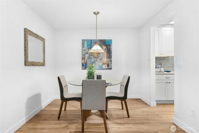 a view of a dining room with furniture window and wooden floor