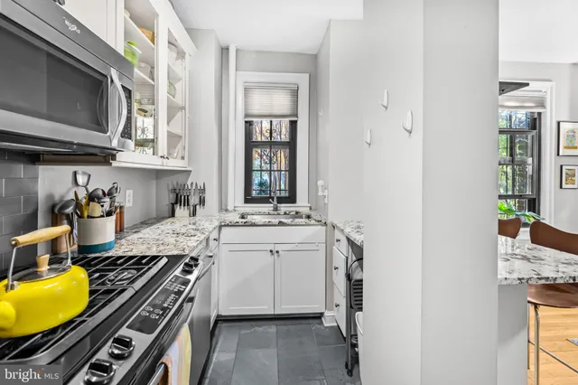 a kitchen with a stove and a sink