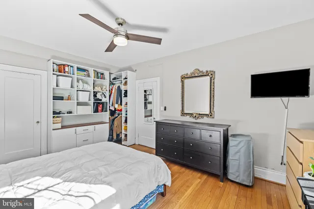 a bed room with a bed and a television