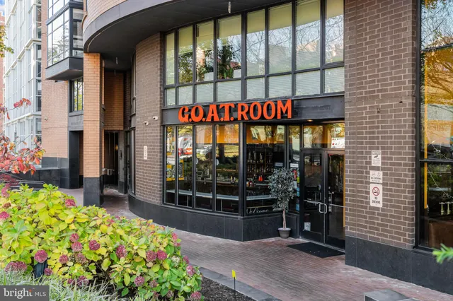 a view of a flower in front of a house