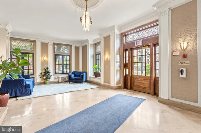 a view of a lobby with furniture and windows