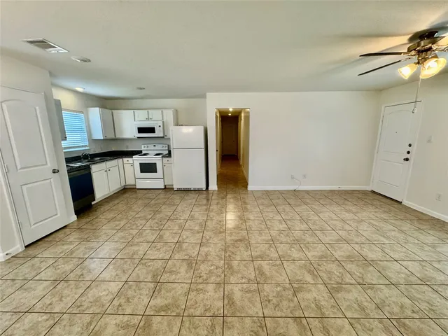 a view of a kitchen with a sink