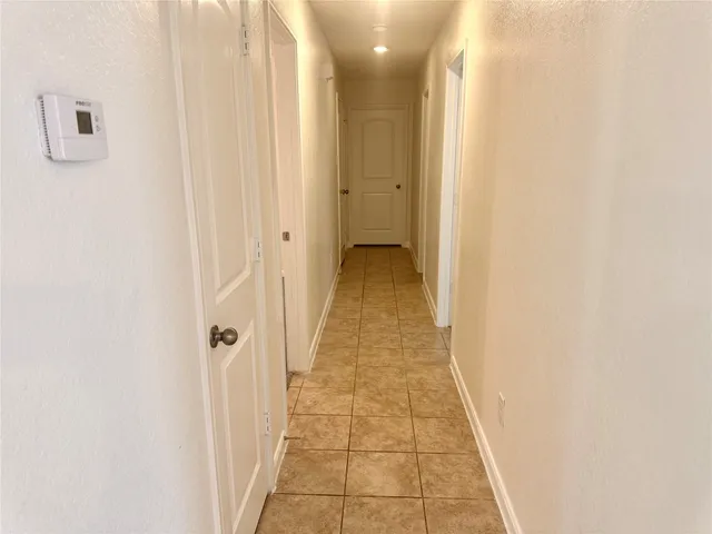 a view of a hallway with a white walls