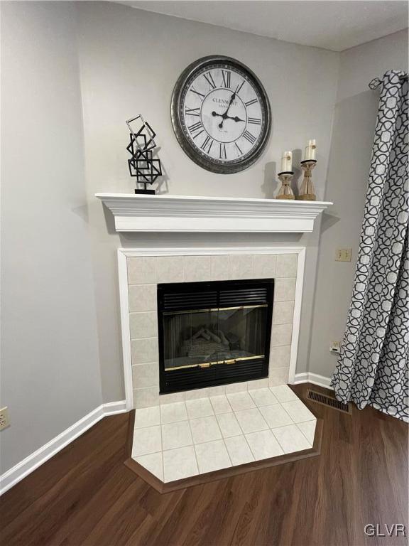1668 Harding Circle Whitehall, PA 18052 - Photo 12 of 32 a living room with a fireplace and a wooden floor