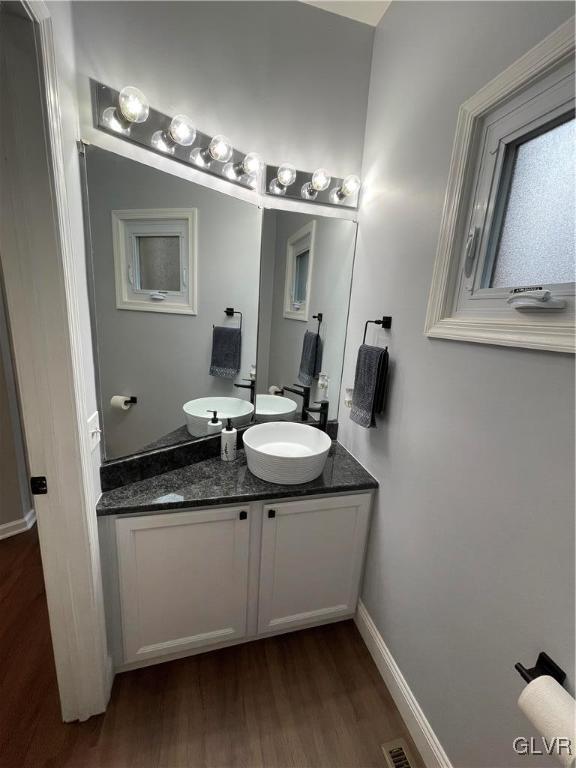 1668 Harding Circle Whitehall, PA 18052 - Photo 13 of 32 a bathroom with a granite countertop sink a mirror and a toilet