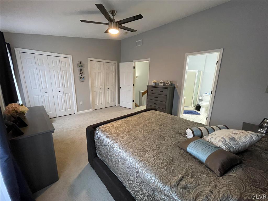 1668 Harding Circle Whitehall, PA 18052 - Photo 18 of 32 a bedroom with a bed and wooden floor