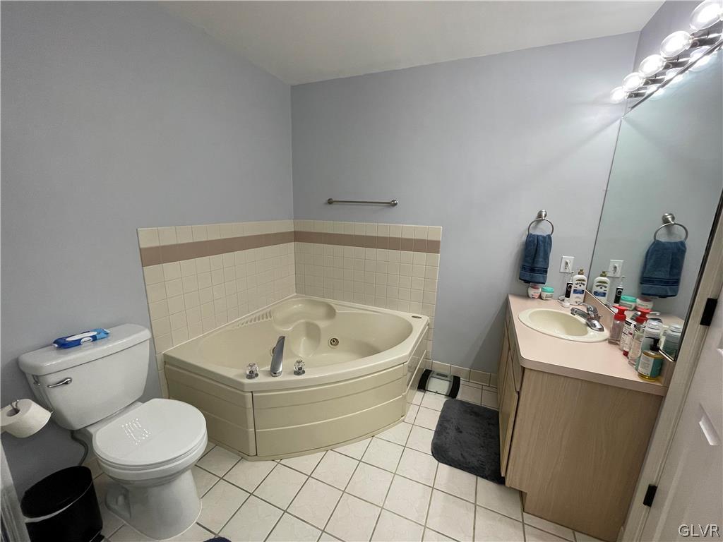 1668 Harding Circle Whitehall, PA 18052 - Photo 19 of 32 a bathroom with a sink toilet and a mirror