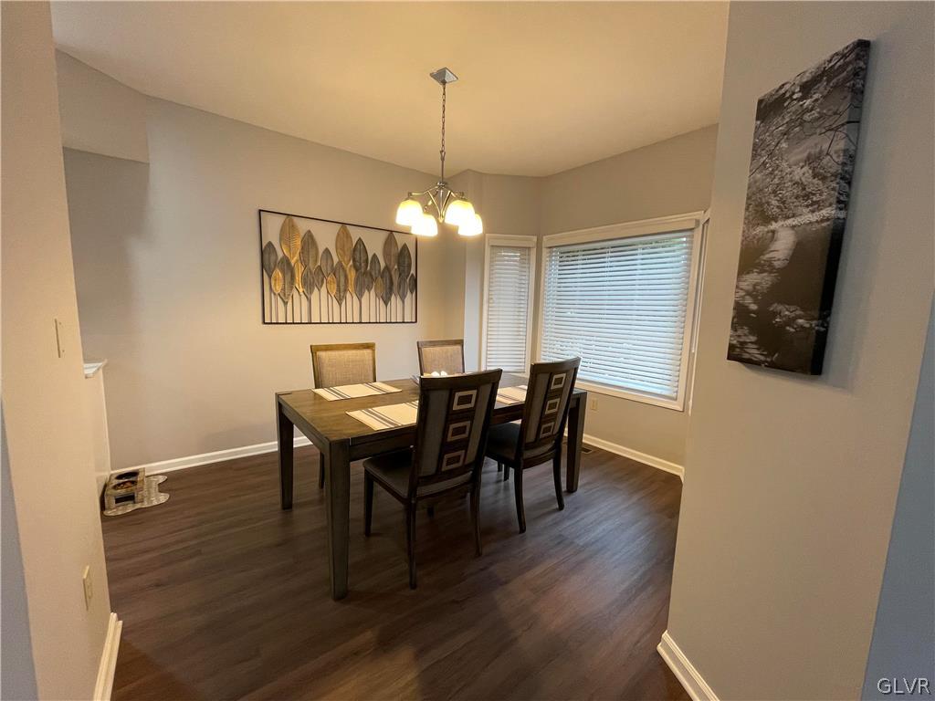 1668 Harding Circle Whitehall, PA 18052 - Photo 4 of 32 a view of a dining room with furniture and wooden floor