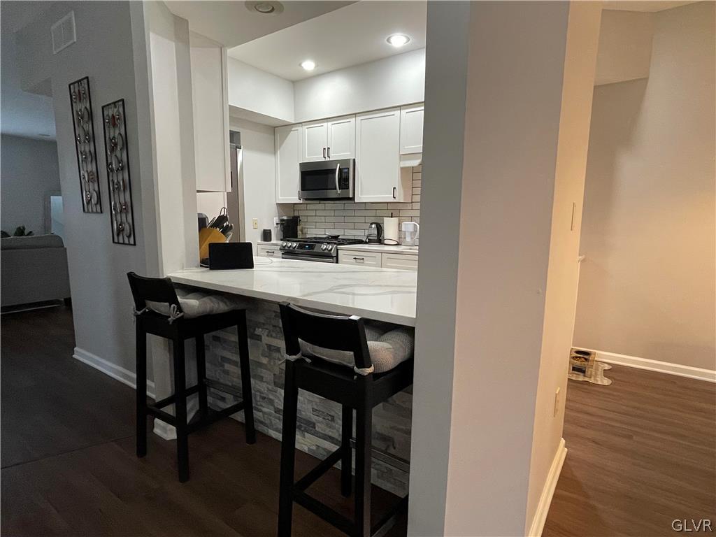 1668 Harding Circle Whitehall, PA 18052 - Photo 8 of 32 a kitchen with stainless steel appliances a sink and cabinets