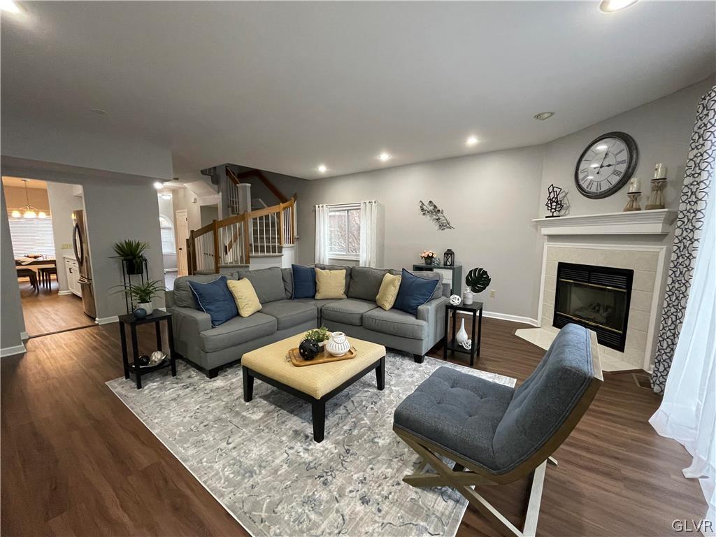 1668 Harding Circle Whitehall, PA 18052 - Photo 9 of 32 a living room with furniture a fireplace a rug and a window