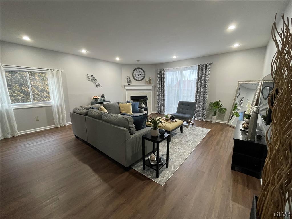 1668 Harding Circle Whitehall, PA 18052 - Photo 10 of 32 a living room with furniture a fireplace and a flat screen tv