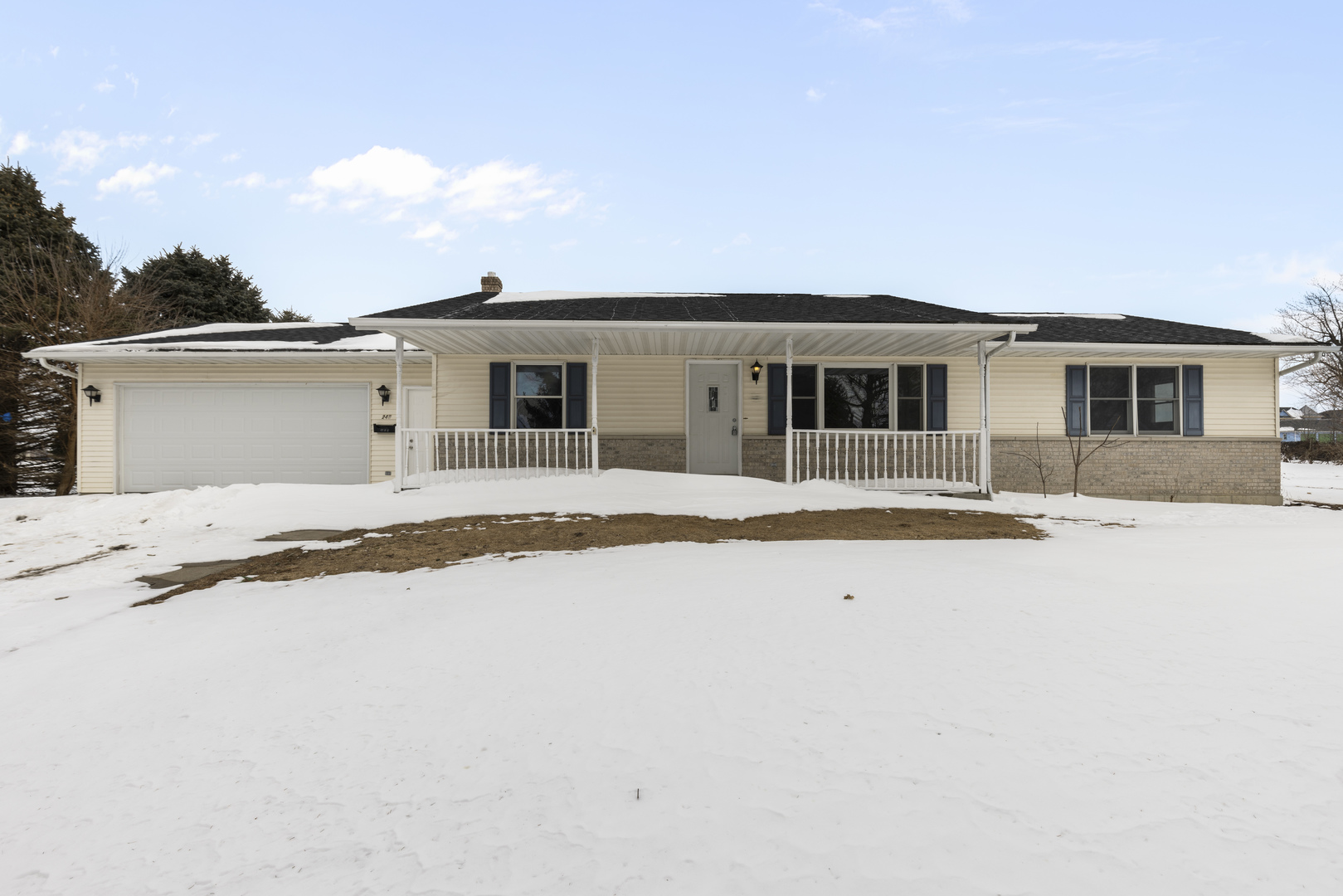 a front view of a house with yard