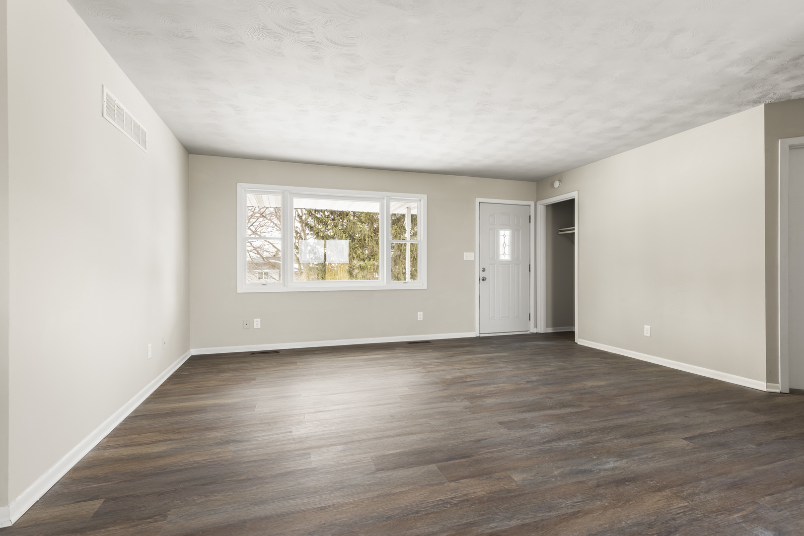 Undisclosed Address Davis, IL 61019 - Photo 12 of 21 an empty room with wooden floor and windows