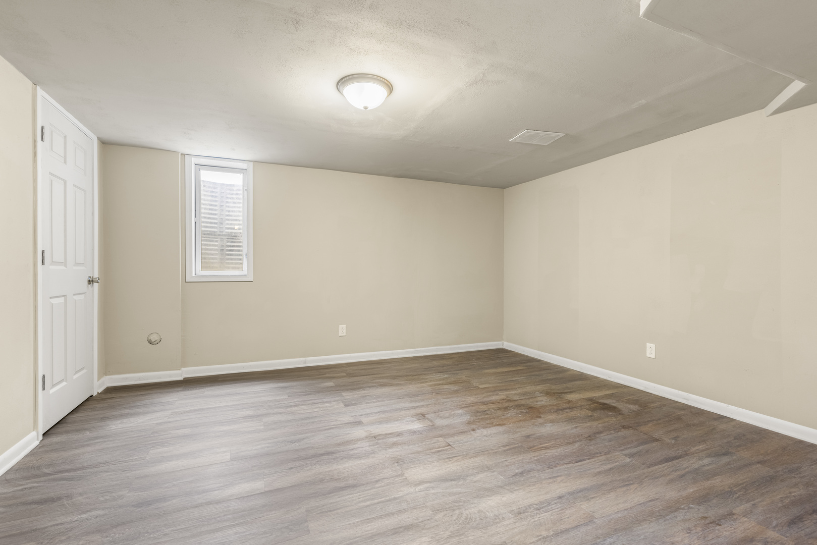Undisclosed Address Davis, IL 61019 - Photo 13 of 21 an empty room with wooden floor and windows