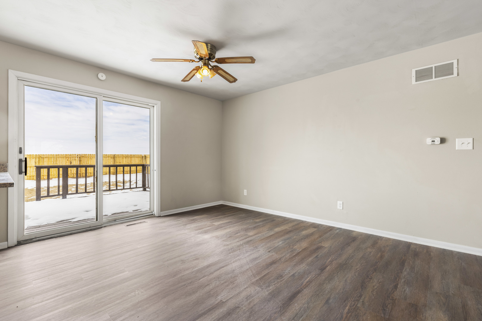 Undisclosed Address Davis, IL 61019 - Photo 6 of 21 an empty room with wooden floor and windows