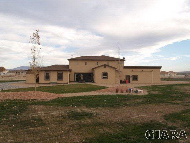 815 Mease Road Grand Junction, CO 81505 - Photo 1 of 42 a front view of a house with a yard