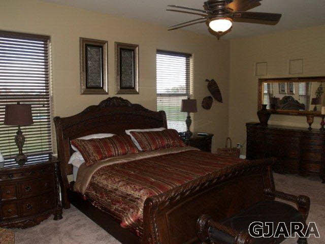815 Mease Road Grand Junction, CO 81505 - Photo 23 of 42 a bedroom with a bed and window