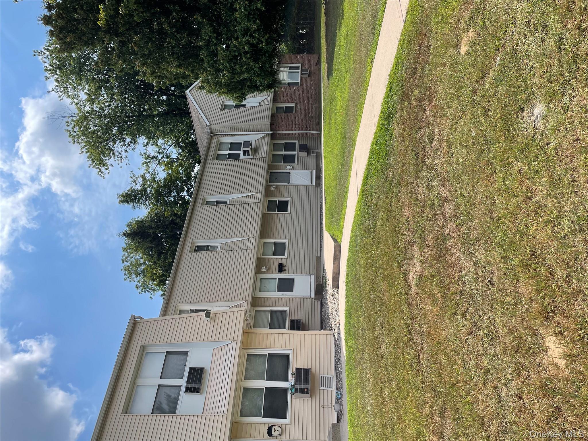 a view of a house with a big yard