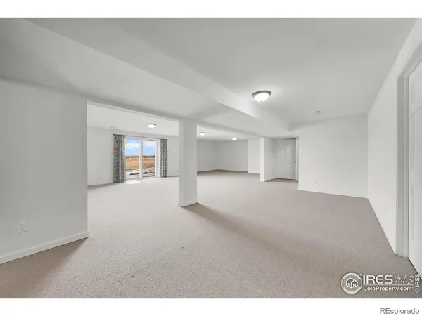 a view of empty room with a fireplace
