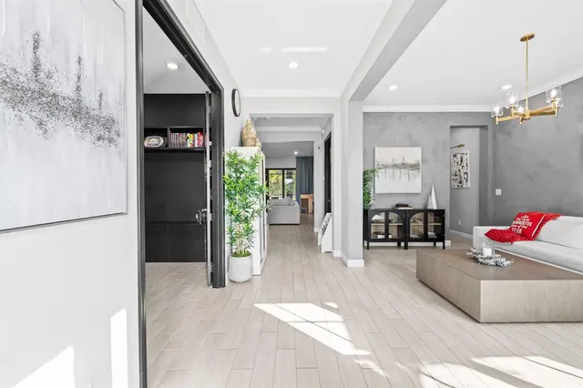 a view of a livingroom with furniture and a flat screen tv