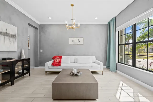 a view of a dining room with furniture and a window