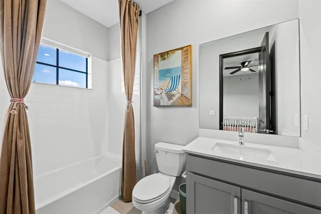 a view of a patio with a table and chairs next to a yard