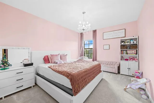 an aerial view of a house with a yard table and chairs
