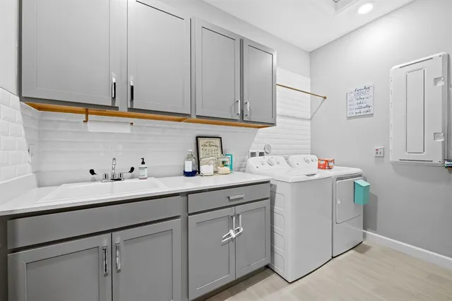 an aerial view of a house with garden space and street view